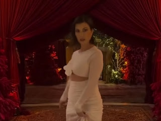 Kourtney Kardashian Looks Heavenly in White Gown while Hosting The Kardashian XMas Eve In Calabasas Home