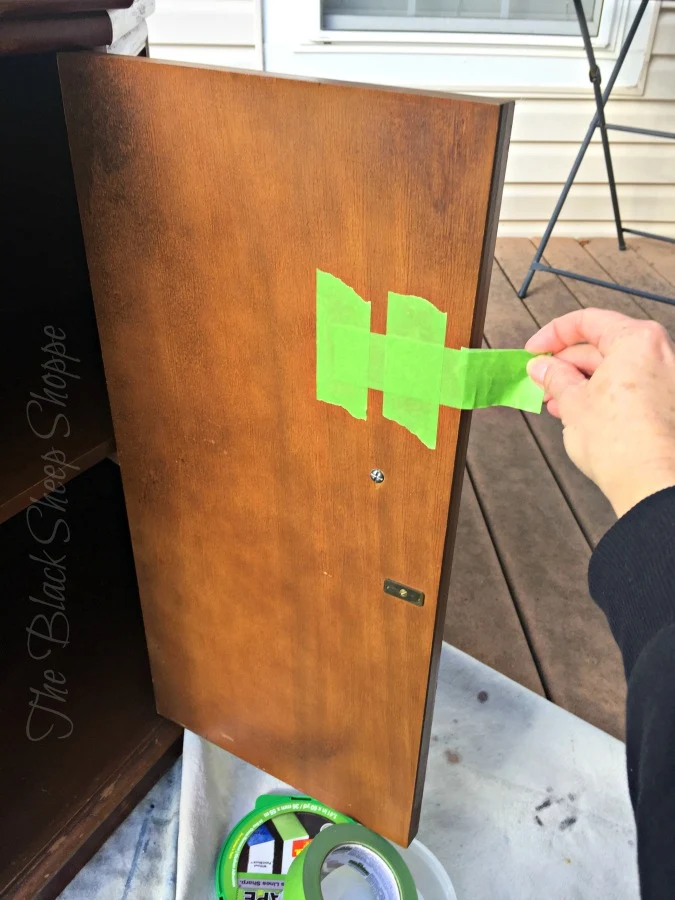 I removed the door pull prior to painting and created a temporary pull with painter's tape.