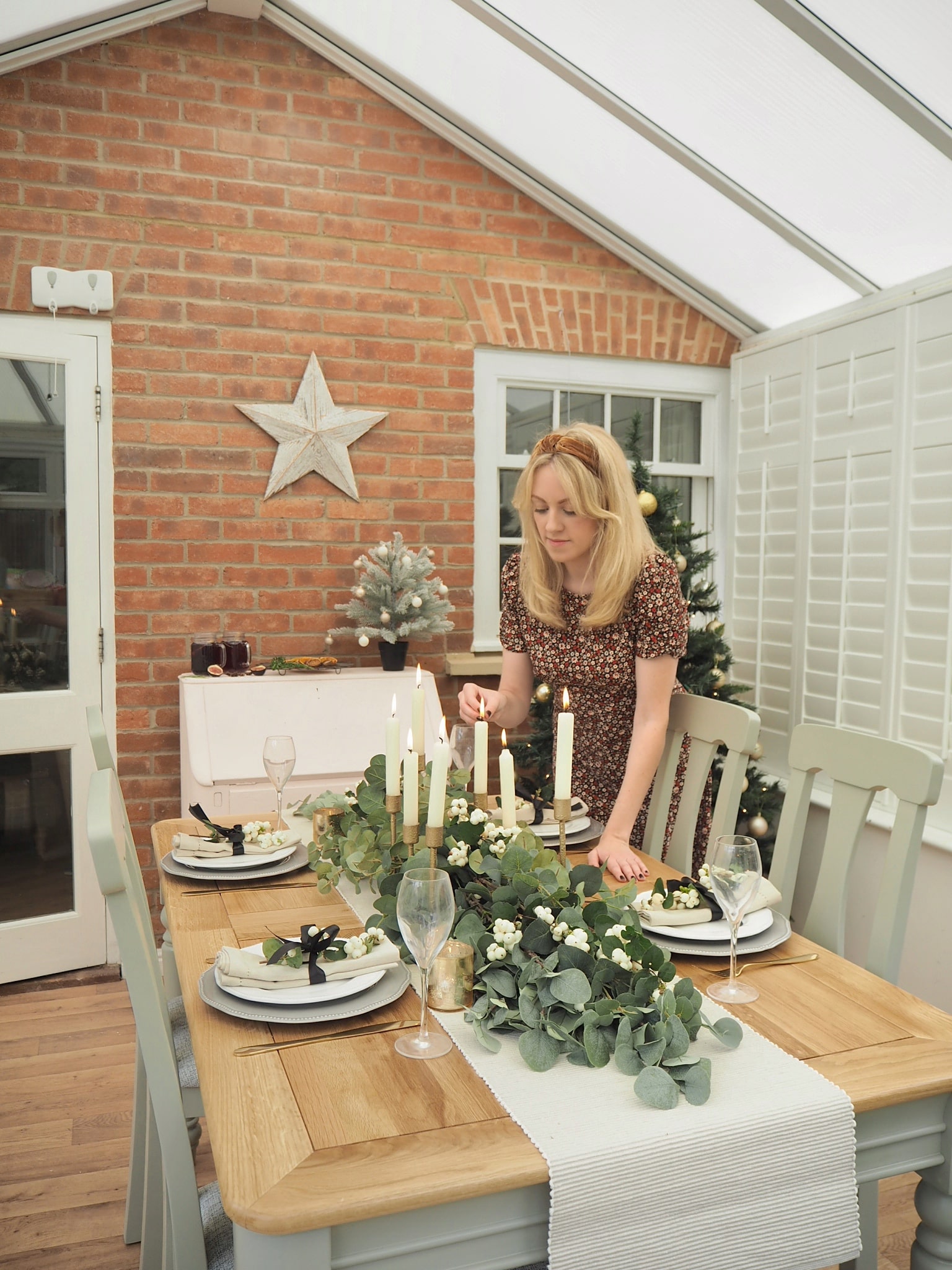 Christmas dining table decor, how to create a garland from faux eucalyptus stems to DIY a budget show-stopping display at home for your Christmas meal