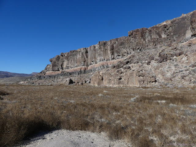 08: cliffs of tuff with prominant pink and black bands