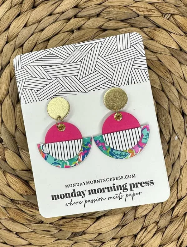 colorful circular paper earrings on shop backing card