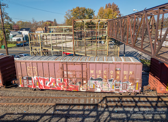 A view looking at the north access ramp, as an ex-Wisconsin Central boxcar on train Q626-06 begins to roll under the Green Bridge