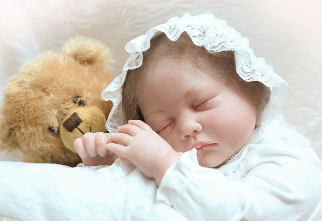 Baby Sleeping with Teddy Bear