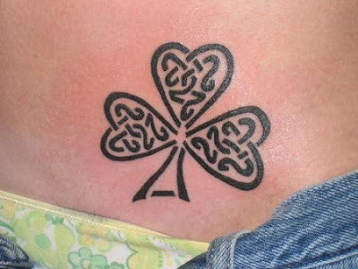 sexy tattoos, shamrock tattoo, stomuch tattoos, tattoos for women, tribal 