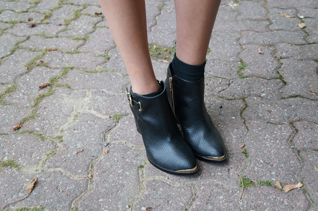 Footwear shot: gold plated material girl heeled booties