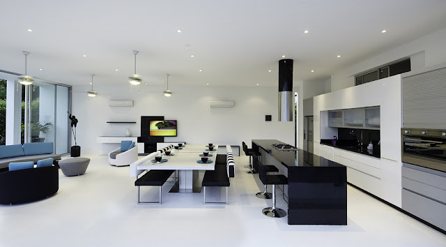 Minimalist black and white kitchen and dining room 
