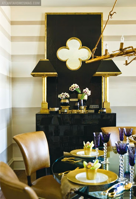 white walls in dining room with gold and black accents 