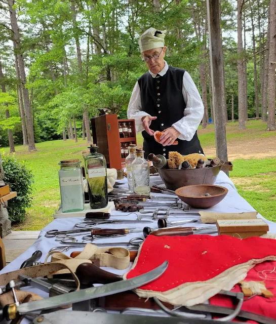 Re-enactor with 18th century medical instruments