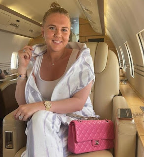 Katie Goodland sitting inside the private jet