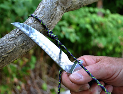 Warther hunting knife in use around the camp