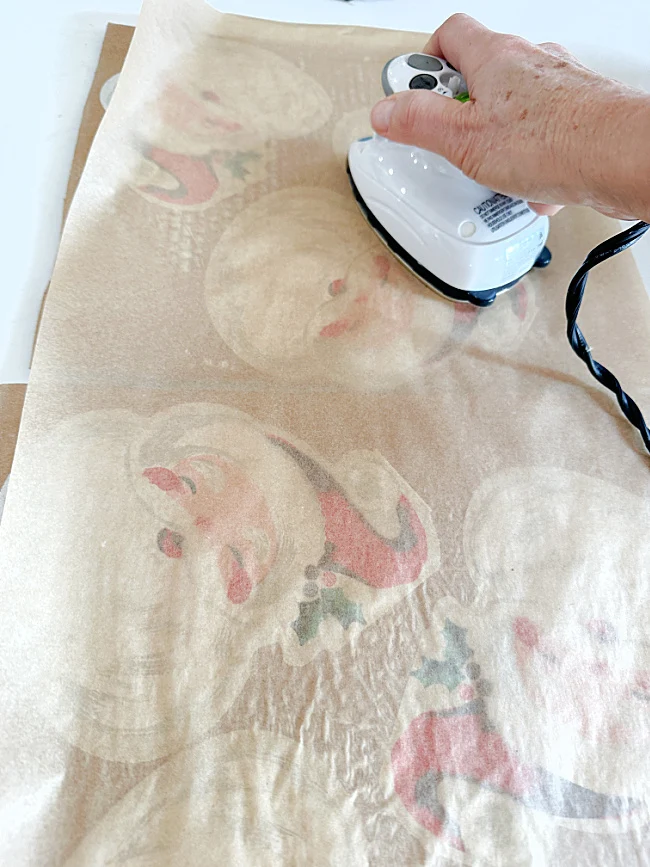 ironing over parchment paper with craft iron