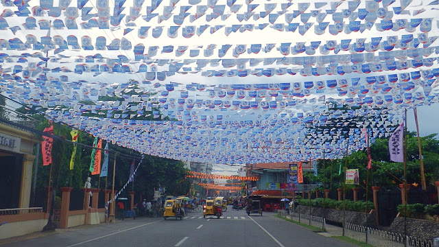 street fully adorned with buntings (banderitas) in front of the the Calbayog City Hall