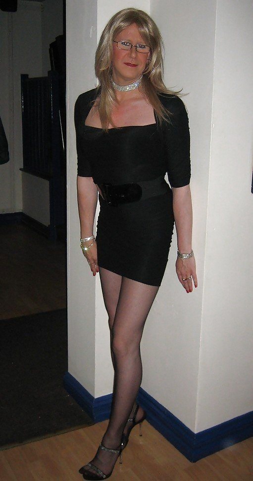 Beautiful mature crossdresser wearing a little black dress with pantyhose and sandals
