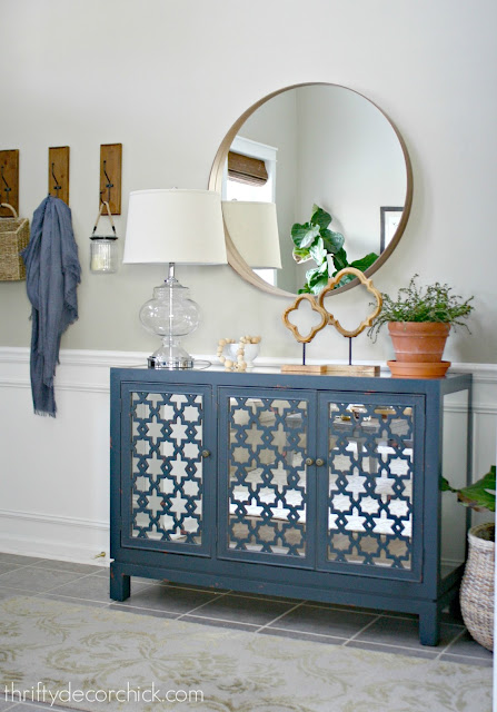 Round mirror in foyer