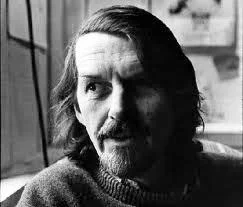 Robert-Creeley Robert Creely con pullover de cuello redondo en gris