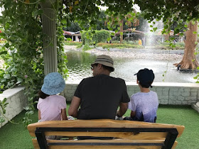 Family sitting in the Dubai Miracle Garden