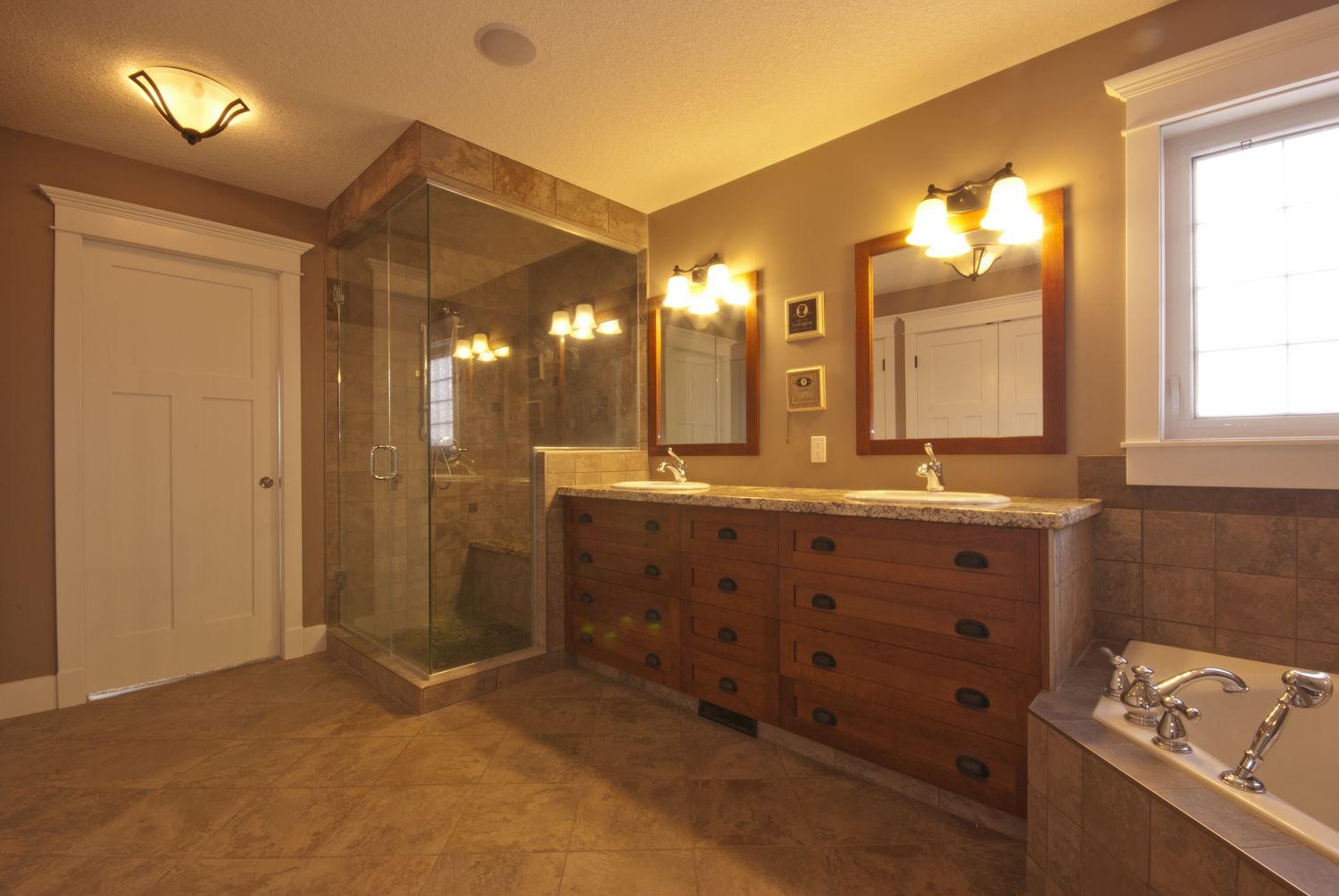 shower bathroom suites Two of the three large custom closets are located in the en-suite.