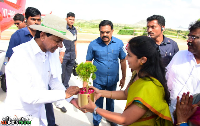 Telangana CM KCR Receiving gift from Swetha Mohanty