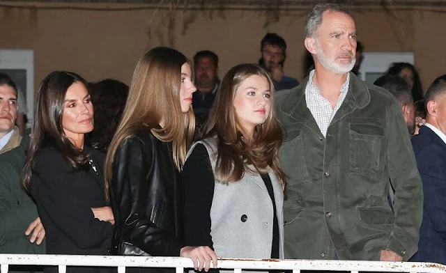 Queen Letizia wore an embroidered contrast sweater by Sfera. Crown Princess Leonor wore a gray vest by Roberto Verino