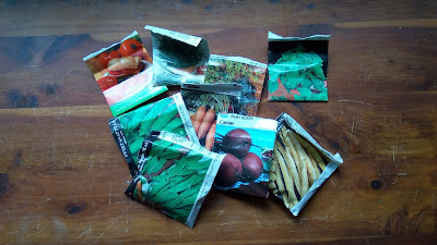 a collection of the seeds we decided to use for the garden, in their packages