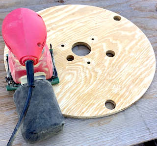 sanding a cable spool