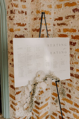 seating chart on easel with boho floral