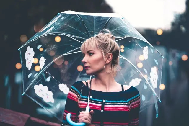 An image of a beautiful girl with lighting umbrella.