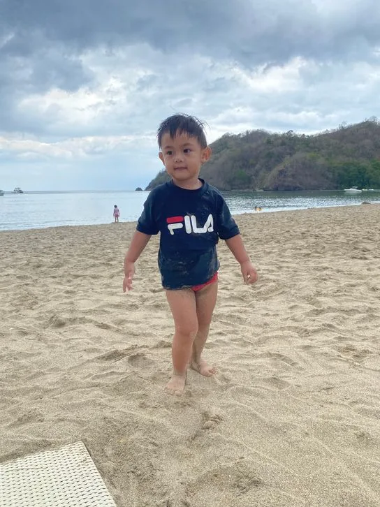 Little boy enjoying Pico de Loro beach