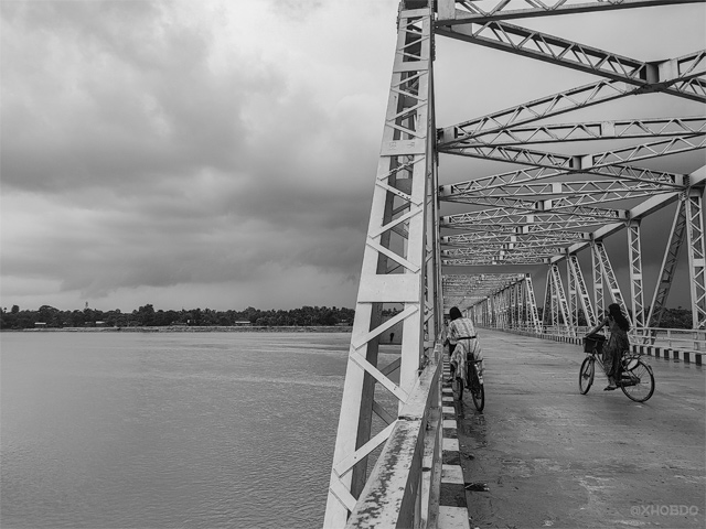Cycling through Baniapara bridge over Gaurangriver, Bilasipara