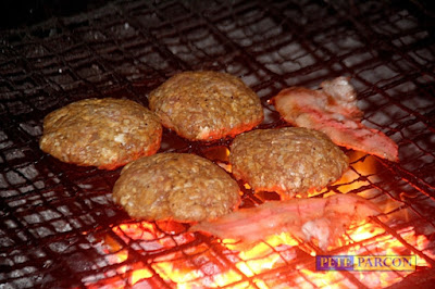 Burgers grilling at Burgaholic