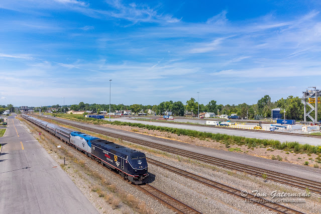 AMTK 100 leads the Lake Shore Limited by DeWitt Yard.