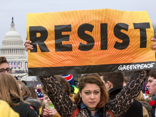 Greenpeace Activist Hangs "Resist" Banner And Joining Women's March in Washington