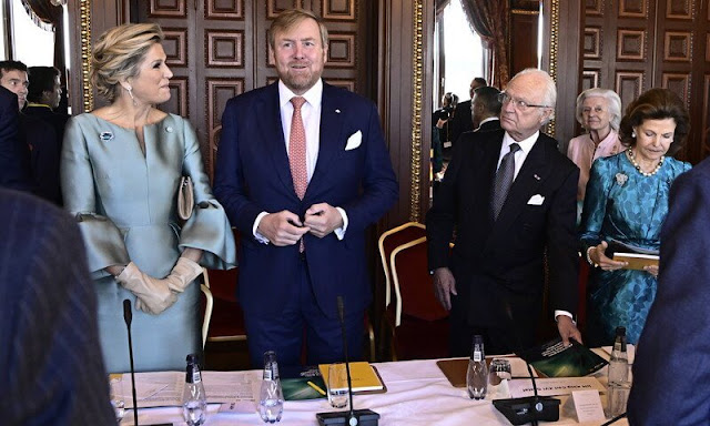 Queen Maxima wore a satin dress by Natan. Princess Victoria wore a botanic dress by Rodejber. Shourouk earrings