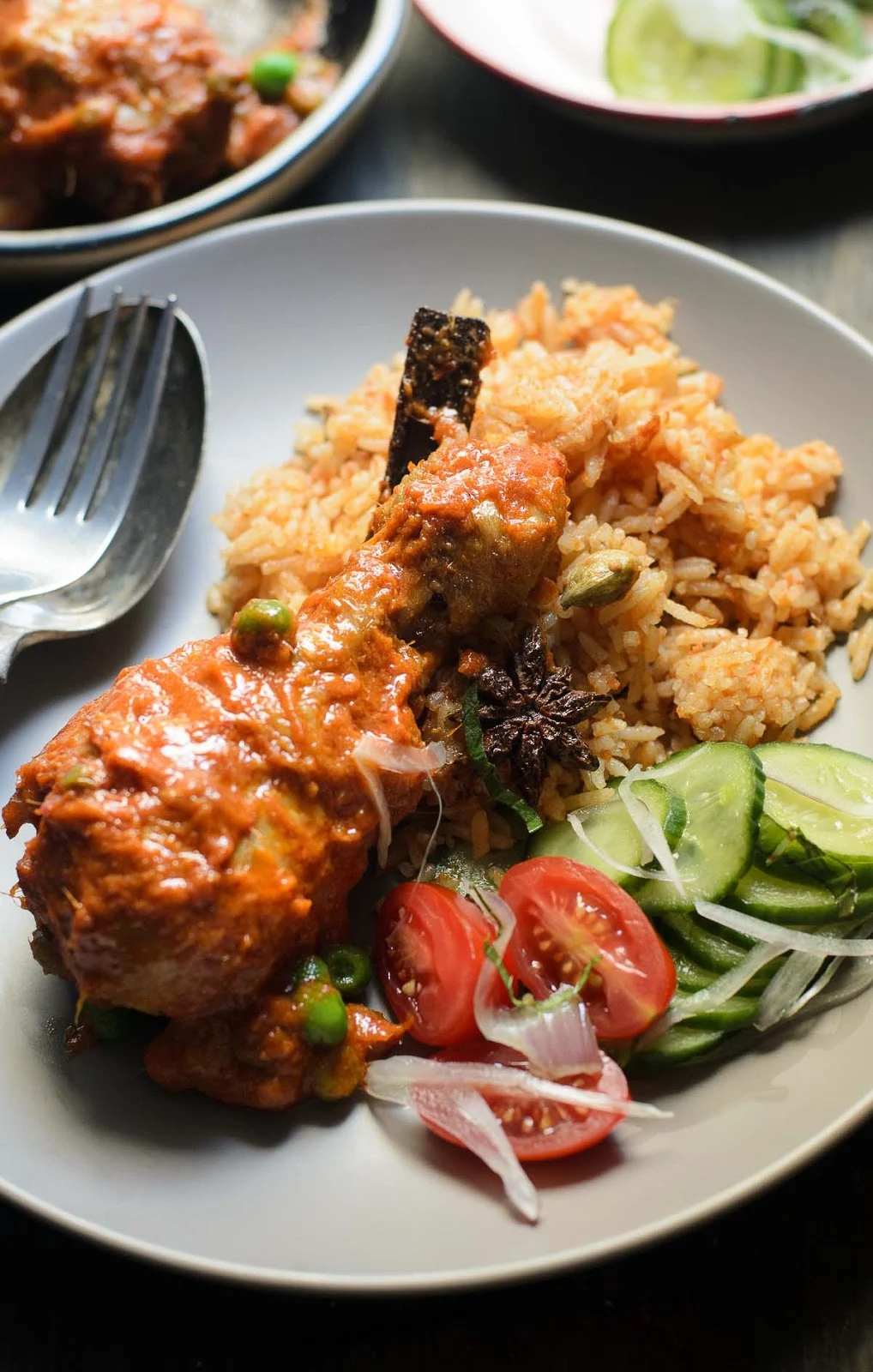 Chicken in Spiced tomato sauce serve with tomato rice