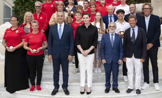 The 46 gold medals were handed out by Princess Charlene of Monaco. Princess Charlene wore a black silk shirt by Akris