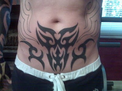 Lower stomach piece tribal tattoo