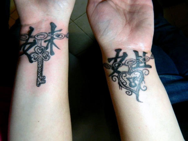 Sister tattoos design ideas heart lock and key bracelet tattoos wearing on wristbands