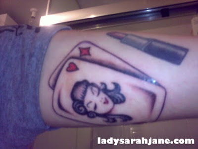  next to a lipstick tattoo I've had for a while. They look cute together.