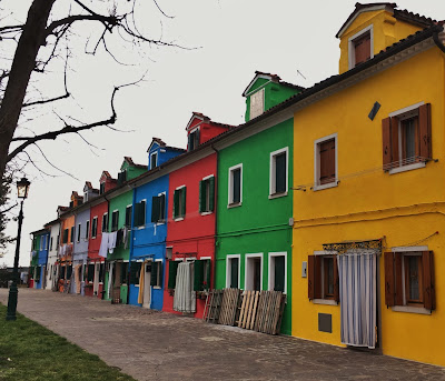 Row of colourfully painted houses on Burano, Italy