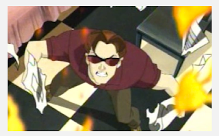 Scott, in a red shirt and sunglasses, glaring upward as burning newspaper scatter around him.