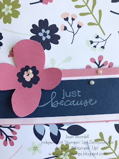 A floral greetings card made using Paper Blooms designer series paper with a large fussy cut flower motif decorating the pink and navy blue sentiment strip which has the sentiment Just Because from the Stampin' Up! Lovely You stamp set