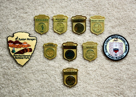 Tessa earned eight badges and two patches for her efforts as a Junior Ranger. All but two badges (Walnut Canyon and Navajo National Monument) were unique in design. Petrified Forest National Park and Walnut Canyon offered patches in addition to badges.