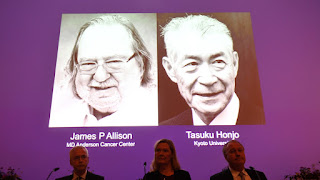 Screen appears: Dr. James Allison (right) and Dr. Tasuko Hongji (left) (Reuters)