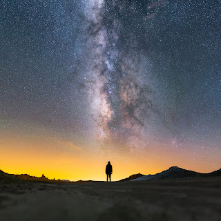 Milky Way lying above a lady at Trona Pinnacles National Landmark, California—Ian Norman (http://www.lonelyspeck.com)—Creative Commons Attribution-Share Alike 2.0 Generic