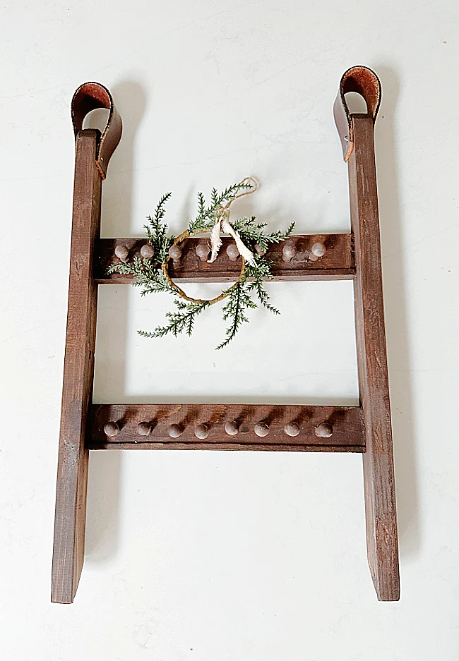 stained pegs with wreath