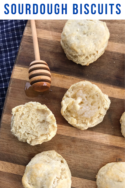 Finished sourdough biscuits on wooden cutting board