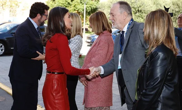 Queen Letizia wore a red frankie cuff detail wool sweater by Hugo Boss. Hugo Boss red leather trousers