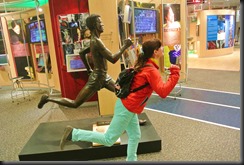 Cheryl remains competitive....even against the Statues.