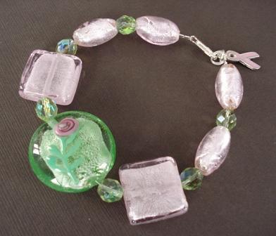 She chose a green silver foil bead with a pretty pink flower design on it