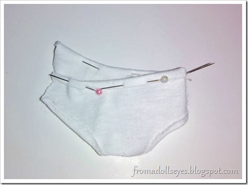 Making underwear for ball jointed dolls.  Double fold and pin to hem the top edge.